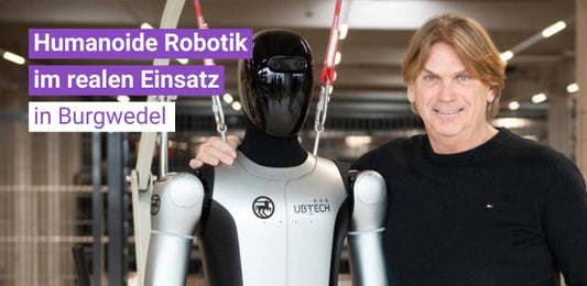 Humanoider Roboter neben einer Person als News-Bild zur Partnerschaft von Terra Robotics mit Rossmann in Burgwedel