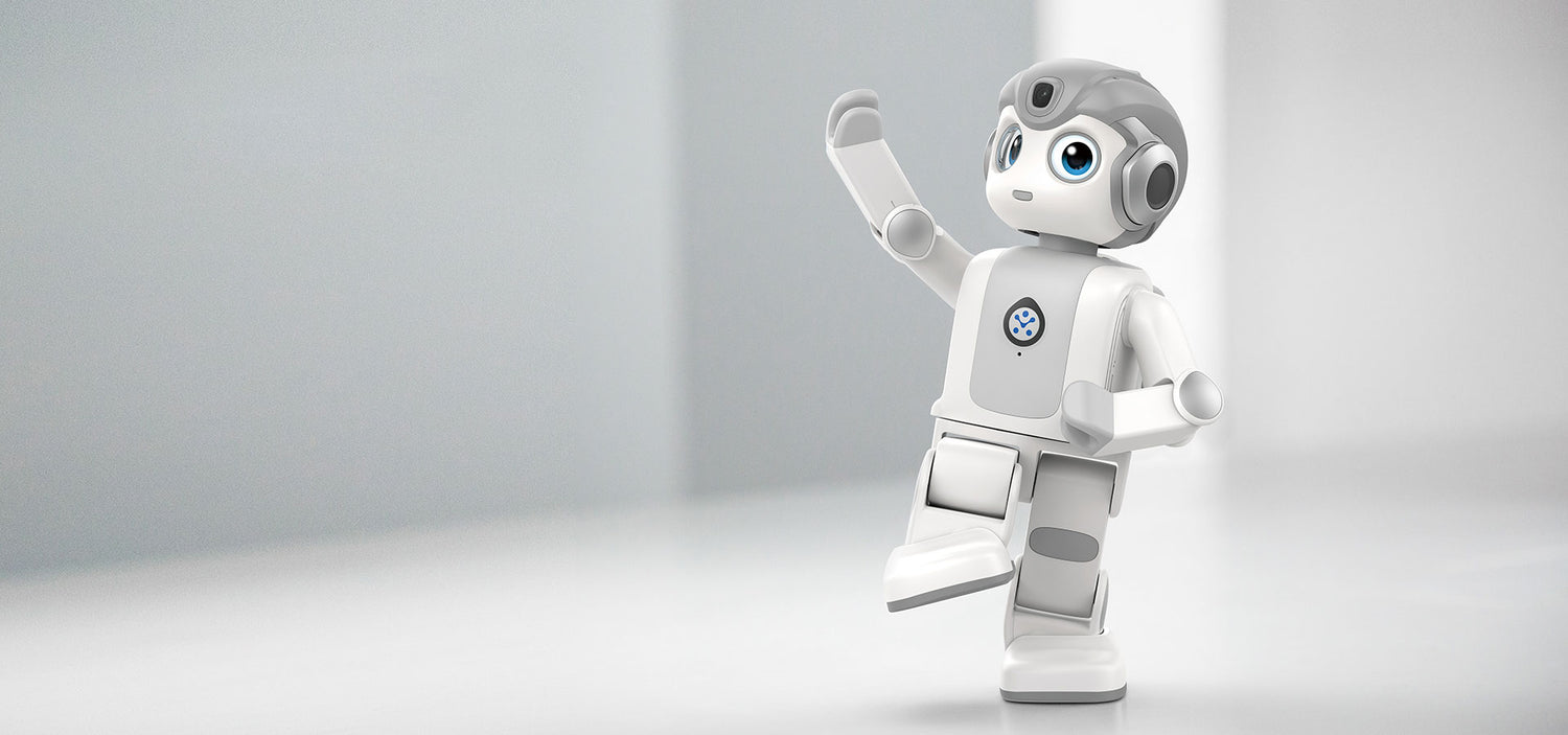 Humanoider Lernroboter Alpha Mini 2 tanzt auf hellem Hintergrund für interaktive Programmier und MINT Bildung