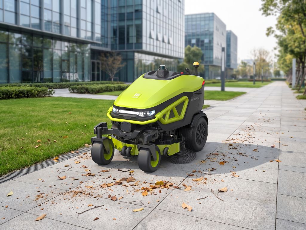 PUDU GT3 bei der autonomen Reinigung eines befestigten Außenwegs.